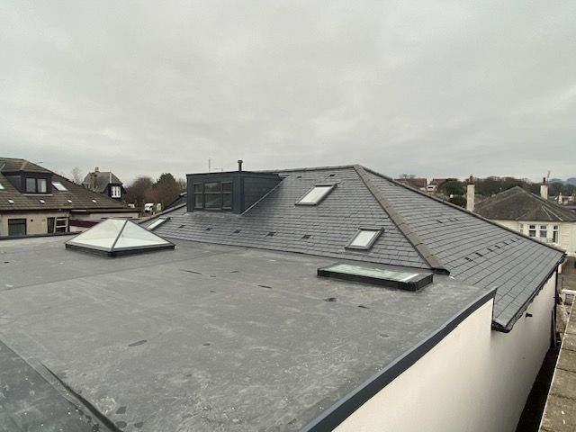 A picture of a flat roof in Edinburgh repaired by Prestige Roofing. From the smallest leaks to ridge tiles, broken or slipped slates, and storm damage – whatever your needs we can help you.