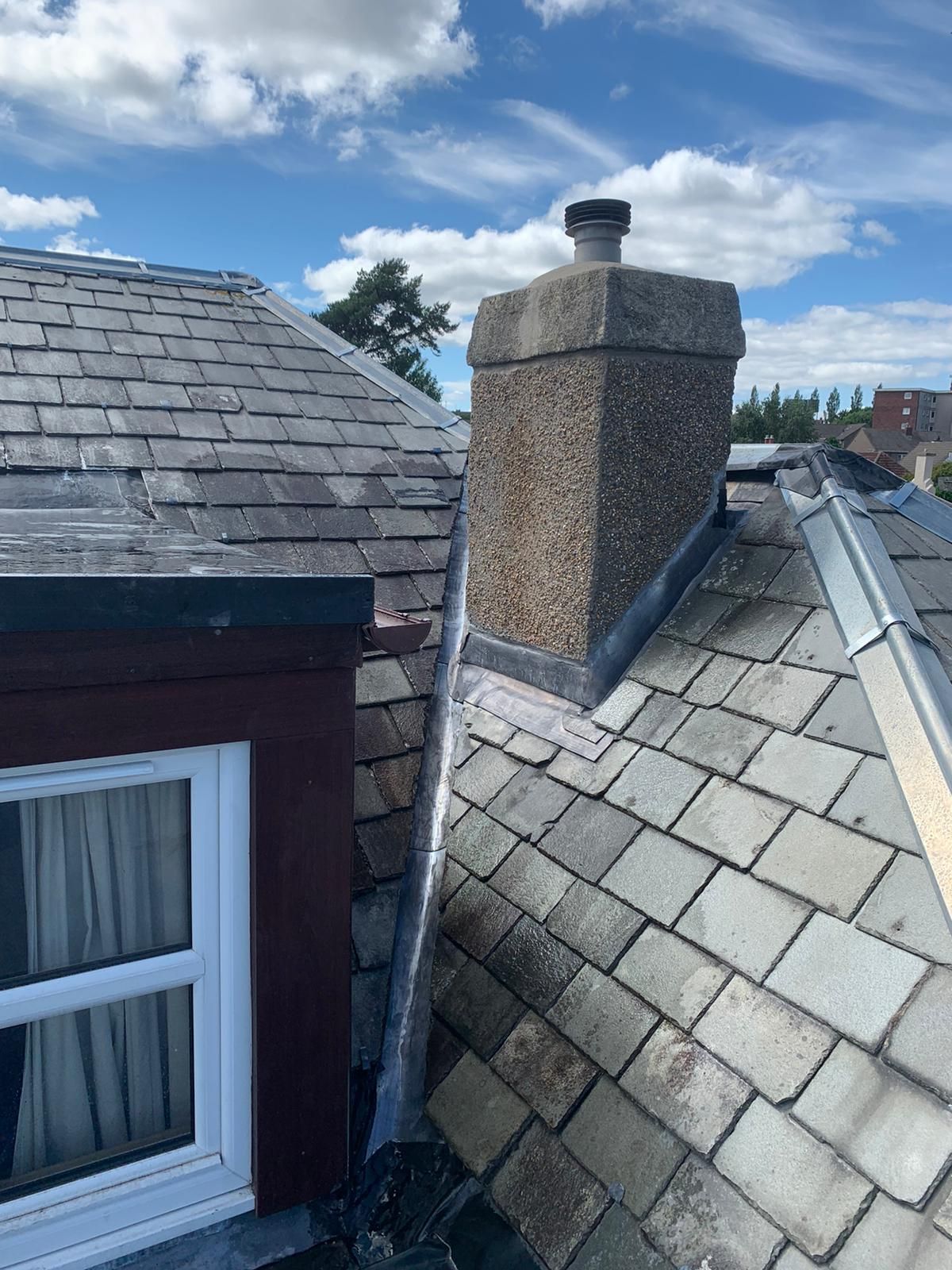 A picture of a chimney with roof flashing in Edinburgh. Chimneys are notorious for being a source of leaks. Often the problem is badly-installed or defective flashings. New flashings, properly installed, will last for many years and protect a property for many years to come.